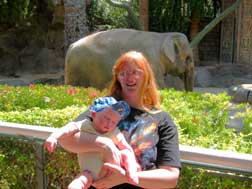 Andy sleeping in front of an elephant